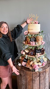 Naomi Griffiths on Instagram: "The Purcells❤️ This was my first wedding cake of 2025 and my first visit to the absolutely STUNNING wedding venue that is Tower Hill Barns💍 This really was the perfect set up for my tower and I was even lucky enough to have the florist add some (food safe) flowers to the display too🌸 The cake on top was extra special here too as it may or may not have had a surprise inside…any guesses?🥰 The Purcells chose: 🎂3 Layer Victoria Sponge Cake 🍪Chocolate Chip Cookies 