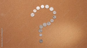 stop motion of a question symbol made up of coins. symbol of question, curiosity