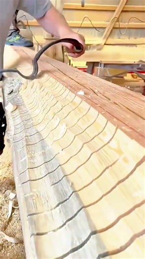 Traditional Hand Hewing Technique for Shaping Timber with a Curved Drawknife Tool