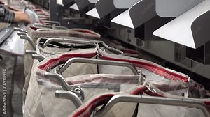 Staff working at the automated parcel sorting system filling bags