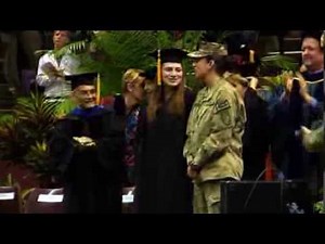 Navy lieutenant surprises sister at Florida State graduation