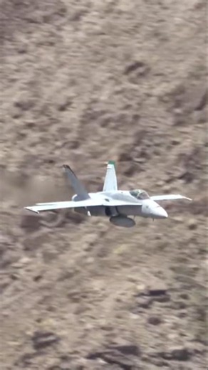Just like *Top Gun: Maverick*! An F/A-18 Legacy Hornet zooms through a narrow canyon