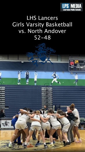 The Girls Varsity Basketball team celebrates their win over North Andover yesterday, 52-48