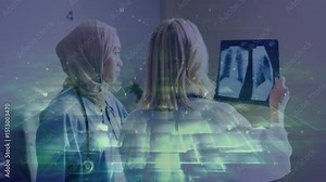 Blonde doctor using tablet and hijab doctor studying X-rays with AI overlay guiding diagnosis