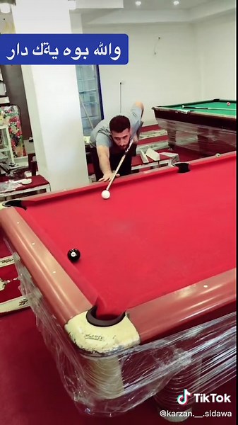 Exciting Pool Game on a Red Table