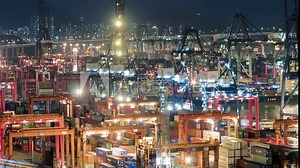 Shipping containers on dock container terminal Container shipyard at Night timelapse