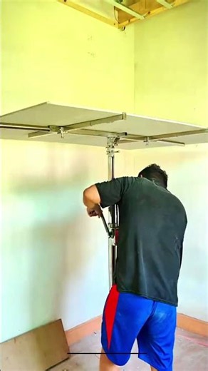Installing Ceiling Panels with a Mechanical Lift Tool