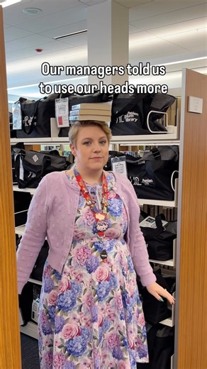 Helen Plum Library on Instagram: "How did we do? We librarians are really good at using our heads. Video description: caption says that our managers told us to use our heads. So, a librarian balances books on her head, another uses his head to push in a book on the shelf, another lowers her head onto her keyboard to search the catalog, and the social media manager sets up her camera and walks toward it with her head into the camera. #HelenPlumLibrary #Lombard #Library #LombardIllinois #Libraries