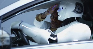 Scientists testing a car driving robot