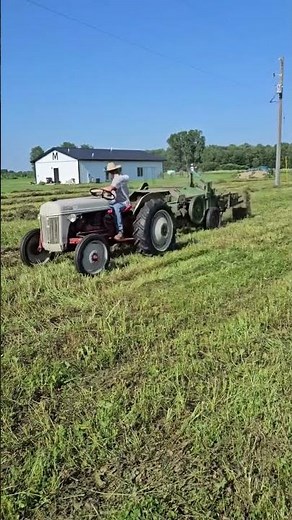 Ford 8N bailing Hay with 14T John Deere baler.