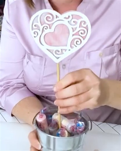 Did you know that you can use coffee filters to create a pretty stained glass effect for your crafts? We used two hear cutouts from the dollar store and sandwiched in between them a coffee filter "stained" with a water-based marker. Makes a cute gift topper or bit of Valentine's Day decor! #crafts #diyideas #dollartreediy #sustainmycrafthabit | Sustain My Craft Habit