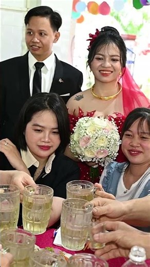 Western Vietnam wedding party: the beautiful bride has tattoos.