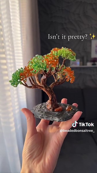 Spent a week creating this tiny beaded tree that's just too cute to handle! What do you think? 😊✨ #tinyart #beadwork #handmade #beadtree #artproject #creativity #artist #art #artwork #bonsai #beadedtree #seedbeads #beads #wiretree #crafts #artistsoftiktok