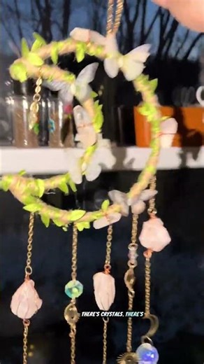 Natural crystal moon and sun sun catcher that reflects sunlight into colorful prism patterns