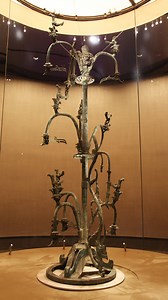 The Massive Bronze Sacred Tree at the Sanxingdui Museum stands at an impressive 396 centimeters tall, making it the largest single bronze artifact ever discovered in the world. The base of the tree resembles three interconnected mountain peaks. From this foundation rises the trunk with three tiers of branches. Nine birds perch along the branches, while a dragon stretches down one side of the trunk, poised to take flight. #TWG2025 #GameonChengdu #ChinaTravel #Chengdu #ChinaTour #Heritage For more