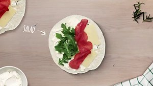 TORTILLA WITH BRESAOLA, ARLA EMMENTAL AND ARLA CREAM CHEESE - The thin sliced bresaola wrapped up with two kinds of cheese in a tortilla is the perfect combination for a bite on the go - bread and packing all in one. Have you got any tips for portable snacks? Share them in the comments. See more delicious sandwiches: www.arla.com/101cheesesandwiches | Arla