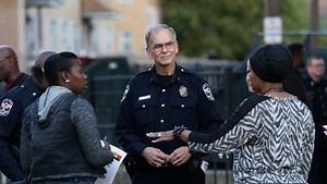 Police walk streets Tuesday near recent gunfire