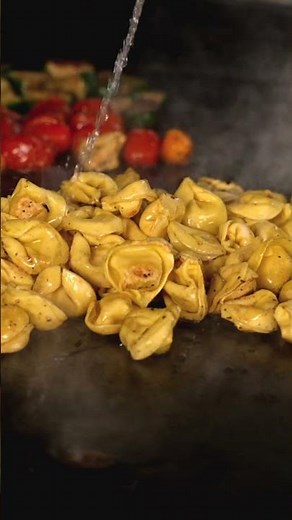 Buttery Herbs, Sizzling Veggies, and Rich Steak on Tortellini