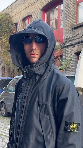 holsales.com on Instagram: "AW98’ Stone Island Jet Black Multi Pocket Nylam Jacket - Online A signature minimal Paul Harvey design that allows the collar to expand into a hood by simply unzipping it. #stoneisland #techwear"