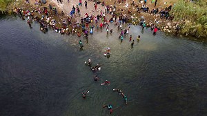 What's happening with migrants, mostly from Haiti, stuck at Texas-Mexico border