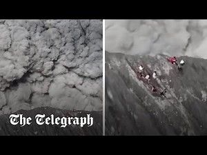 Moment climbers run for their lives as volcano erupts in Indonesia