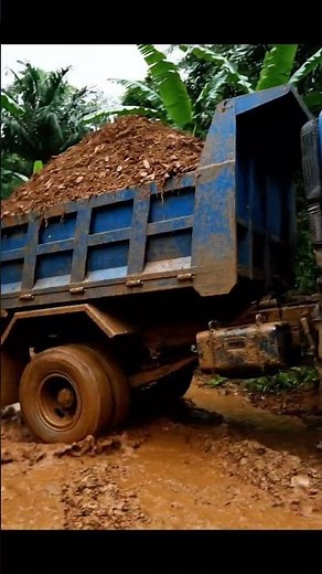 Dump Truck FAIL! Slides in Deep Mud and Crashes HARD Into Tree