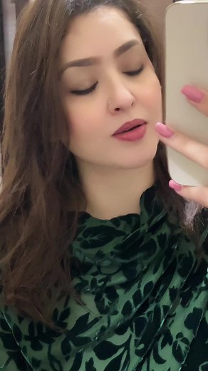 Person with Brown Hair in Green Garment