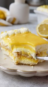This Limoncello Tiramisu is absolutely delicious, with creamy Limoncello mascarpone, lemon curd, and ladyfingers soaked in a Limoncello syrup. This is also an eggless recipe, and comes together super easily. 🍋 Check out this amazing recipe here: https://www.piesandtacos.com/limoncello-tiramisu/ | Pies and Tacos