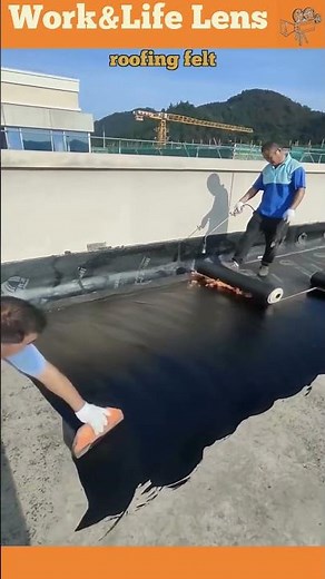 Roofers apply hot bitumen and felt layers for a durable, waterproof, long-lasting roof.