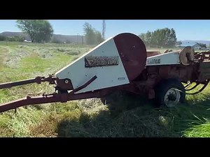 Baling hay with Ford 7000 and old Freeman baler.