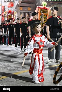 (240601) -- SHANTOU, June 1, 2024 (Xinhua) -- Zhuang Enqi practices Yingge dance with a troupe in Yujiao Village of Guiyu Township, Shantou City, south China's Guangdong Province, May 29, 2024.  The Yingge dance, or "dance to the hero's song," is a form of folk dance popular in south China's Guangdong Province that merges opera, dance, and martial arts. Dating back to the Ming Dynasty (1368-1644), this traditional dance is often performed during traditional Chinese festivals. The Yingge dance wa