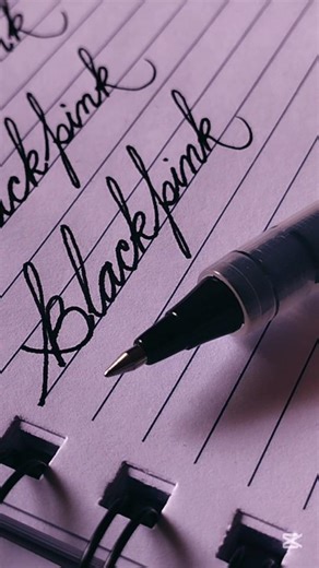 Writing 'Blackpink' with ink. Beautiful handmade calligraphy letters
