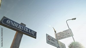 Traffic signs at an intersection in one of the smallest Dutch towns, Bronkhorst, The Netherlands.