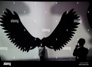 Bandung, West Java, Indonesia. 15th June, 2022. A couple take a photo with the backdrop of video mapping to show the k-pop BTS in Bandung. The show, which was held by Kala Kini Nanti with Senyum ARMY, was held to commemorate the 9th anniversary of South Korean music group BTS as well as fundraising for out-of-school children throughout Indonesia. (Credit Image: © Algi Febri Sugita/ZUMA Press Wire Stock Photo - Alamy