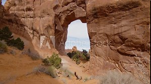 Typical red rock formations in Arches National Park with a huge hole in the rock, Utah, USA