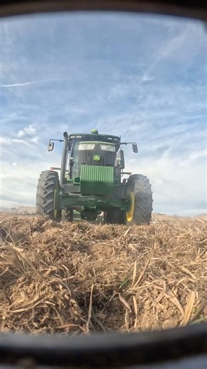 John Deere 7215R driving over the indestructible GoPro case