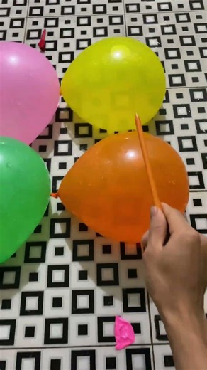 Experiment: Will a water balloon explode when it rolls down from...