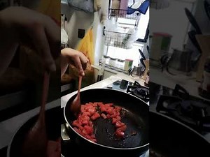 COOking elbow pasta with tomato,brocoli.and ground pork