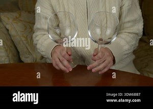 Clinking two wine glasses one to another Stock Video Footage - Alamy