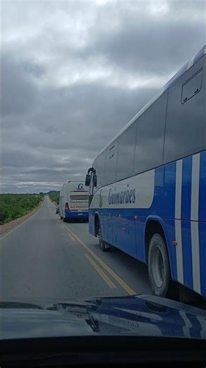 Two Marcopolo Buses from Viação Guimarães traveling on highway BA-314 in the Pilar District, Bahia.