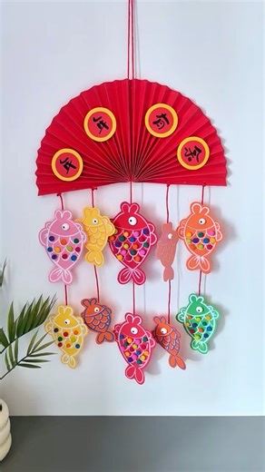 Colorful DIY fish mobile for a festive touch! #diy #shorts #ytshorts #art