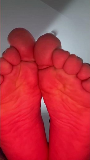 Giant male feet crushing tiny slave