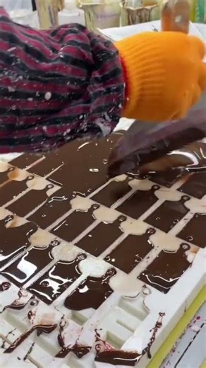 The process of molding chocolate in making sweet chocolate candy#food #youtubeshorts