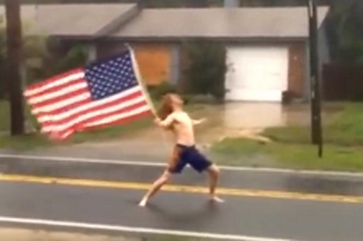 Shirtless man rocks out to Slayer during hurricane