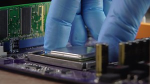 High tech. The process of installing a processor on a computer motherboard. Close-up 4K
