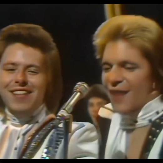 8.5K views · 90 reactions |  'Top of the Pops' Thursday 07 November 1974 - BBC1: 19:20 The Glitter Band ~ Let's Get Together Again (#8) Sounding like an unused title from bad old Gary himself, this single bought the Glitter Band a bit more career time in late '74.The melody could be a GG backing track too as evidenced by Mike Leander on the production desk but while it's undoubtedly derivative and all, that air-punching chorus is boffo for belting out. | Bernie Briffa | Facebook