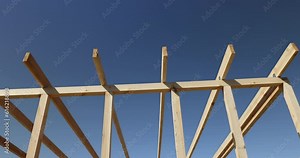 the wooden part of the prefabricated structure of a frame building, connected boards and beams during the construction of a frame one-story building