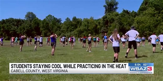 Cabell Midland marching band working to stay cool while out in the heat