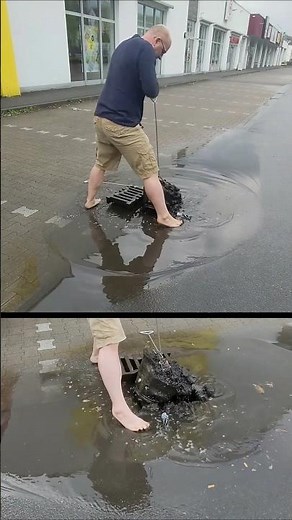 S#067-3 Unclogging a storm drain on a parking space after rain in Germany, #shorts