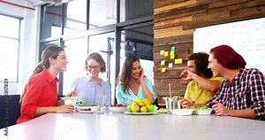 Colleagues eating lunch together